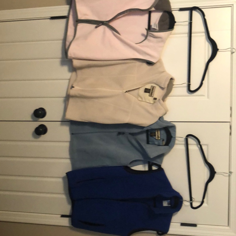 Multiple fleece vests - pink, 2 blue, one tan